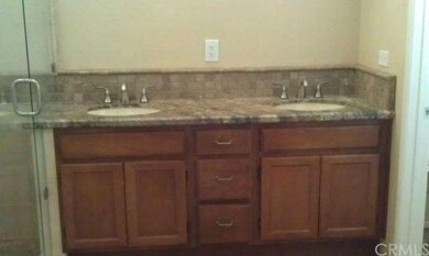 Dual lav vanity with granite counter.