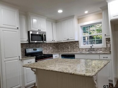 Granite Counter Tops in Open Setting Kitchen