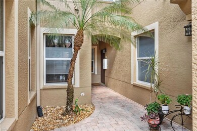 Entrance to property with stucco siding