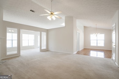 Open View of Great Room/Sunroom, & Formal Dining R
