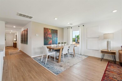 Dining area featuring baseboards, light wood finis