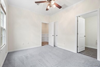 Unfurnished bedroom featuring ornamental molding,