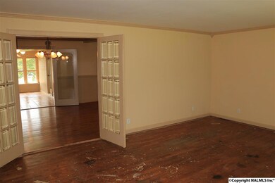 With hardwood flooring (needs some work).