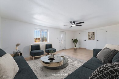 Living area featuring wood finished floors and cei