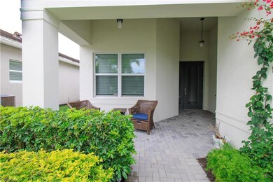 Property entrance with a patio