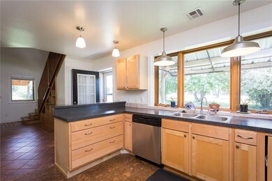 Amazing view from the kitchen sink area with an adjacent dining area.