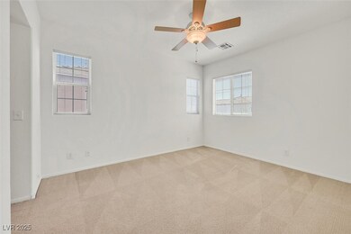 Spare room featuring light carpet, baseboards, and