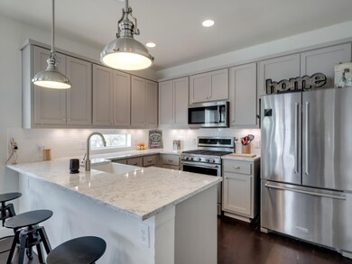 Kitchen with stainless steel appliances, a penins