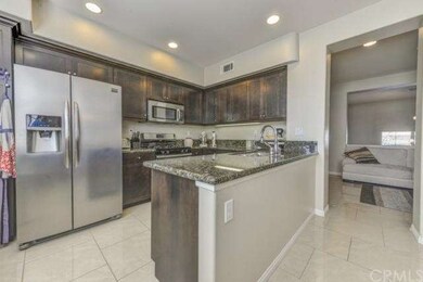 Nice open kitchen! With Beautiful dark cabinetry.