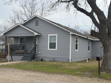 Bungalow-style home with covered porch and a fron
