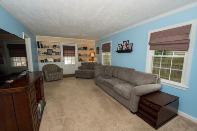 Large living room with built in shelves.
