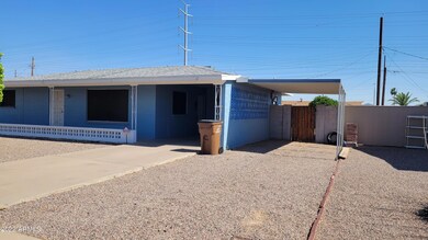Front w_carport & additional covered par
