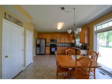 Large, spacious light filled kitchen features wood