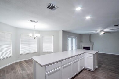 Kitchen featuring open floor plan, a chandelier, 