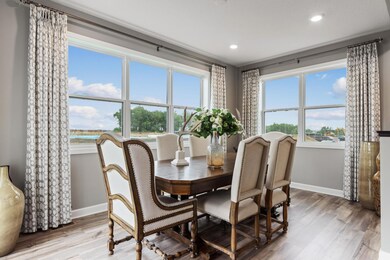 Wow, talk about natural light! The highly desirable morning room off the kitchen, is a statement maker! Complete with loads of windows, recessed lighting, and plenty of space to accommodate many furniture options to entertain friends & family. Photo