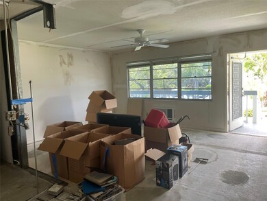 Living area facing front door...lots of natural li