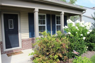 Covered front porch with area for seating.