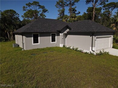 Ranch-style house with stucco siding, a front lawn