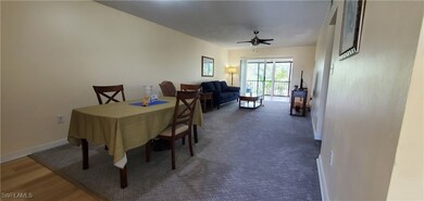 Dining space with carpet floors and ceiling fan