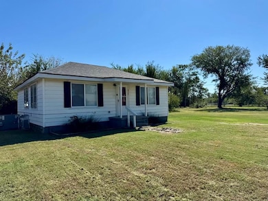Bungalow with a front yard, entry steps, and roof with shingles