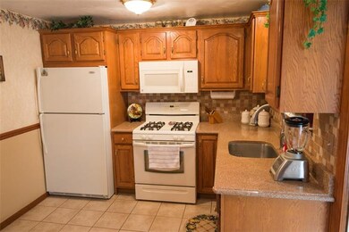 Newer kitchen with granite counters.