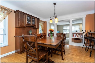 View of wood floored dining space