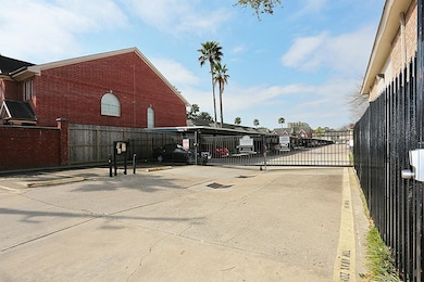 Gated community with covered parking spaces. 