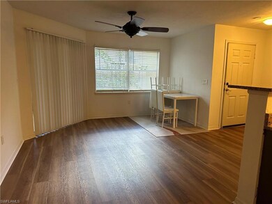 Spare room featuring dark hardwood / wood-style floors and ceiling fan