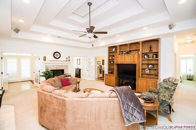 Living room leads to another sitting area and scre