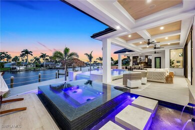 View of pool with an outdoor hot tub, ceiling fan,