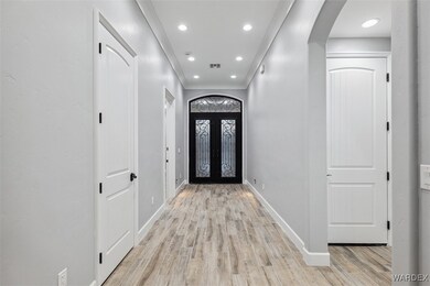 Entrance foyer with light wood-type flooring and f