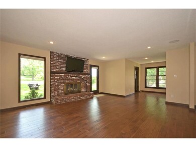 first floor great room with gas start wood burning fireplace. New bamboo floor throughout living spaces