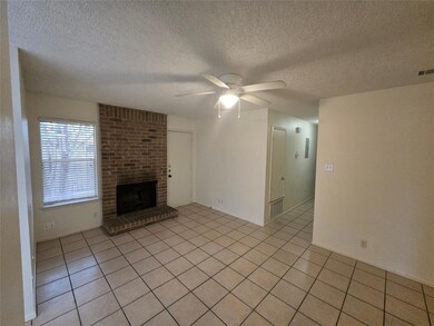 Unfurnished living room with ceiling fan, light t