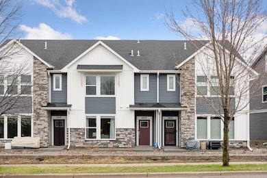 Darling unit with a front patio overlooking green space.