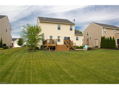 Rear yard with large deck and patio set to enterta