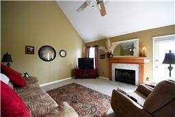LARGE GREAT ROOM WITH VAULTED CEILING AND WOOD BUR