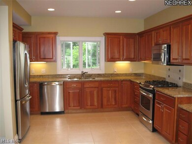 Large kitchen renovated with space added in 2007.  Custom cabinets, granite counter-tops, stainless appliances.