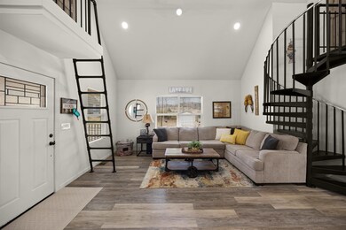 Living room featuring recessed lighting, high vaul