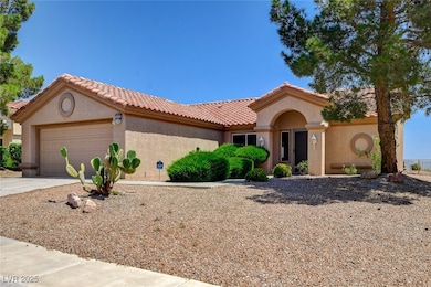 Mediterranean / spanish-style house with an attach