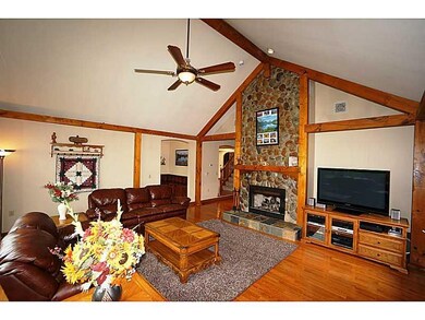 Great Room. The floor to ceiling stone fireplace i