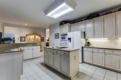 A 2nd island has granite-topped cabinets, a breakf
