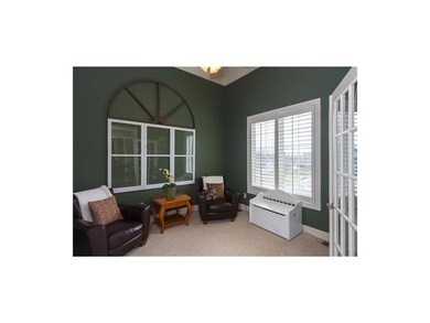 Office/den adjacent to foyer has vaulted ceiling a