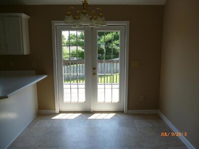 DINING ROOM PATIO DOOR LEADING TO LARGE DECK