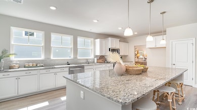Kitchen featuring stainless steel appliances, a he