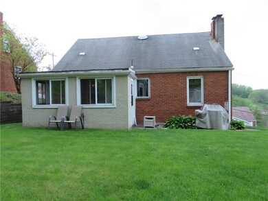 Flat back yard with three season room.