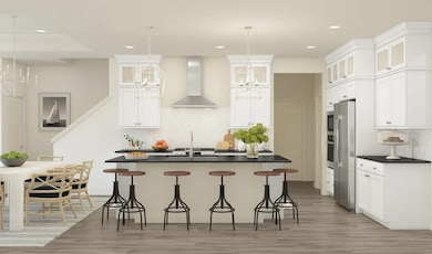 Kitchen with pendant lighting and glass upper cabinets