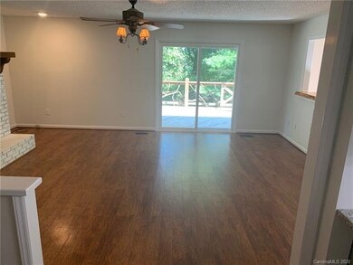Great room with new sliders leading out to deck