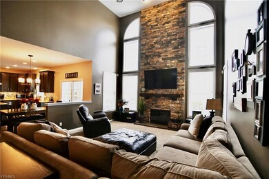 Living Room with floor to ceiling stone fireplace 