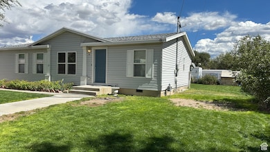 View of front facade featuring a front lawn and crawl space