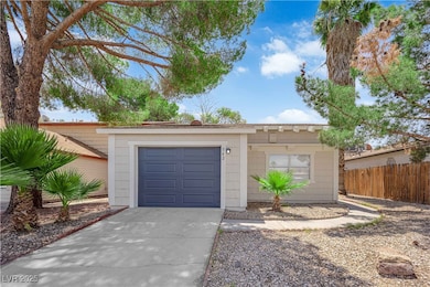 Single story home featuring driveway and a garage